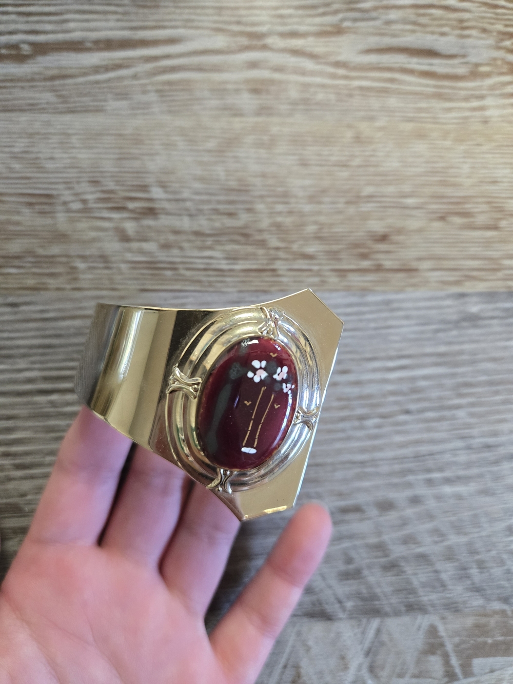 Gold-Tone Cuff Bracelet with Burgundy Cabochon